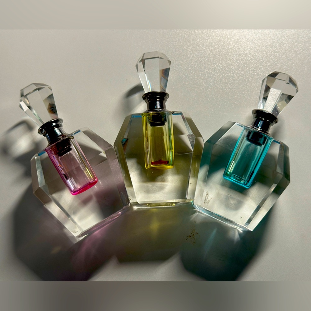 3 Stunning Cut Crystal Perfume Bottles. Clear with a liquid well in soft colours
